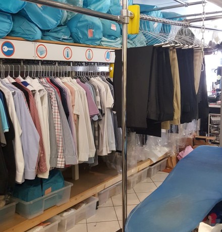 Shirts and trousers on rail Shirts and trousers on rail