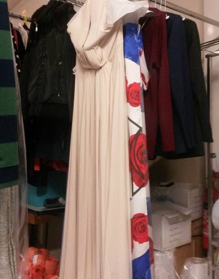 Dress and other clothing on rack Dress and other clothing on rack