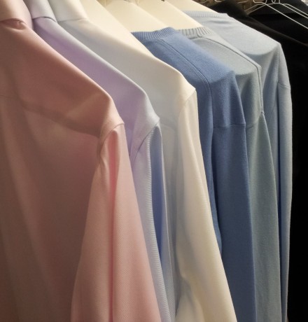 Railed Shirts and Jumpers Rail of shirts and jumpers close up